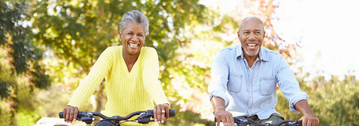 retired woman and man riding bikes